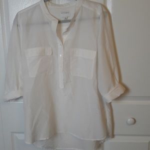 Long sleeved white botton front shirt. NWOT